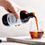  First Press Coffee - Big Boy 500ml Original Cold Drip Coffee - A bottle pouring into Glass over ice